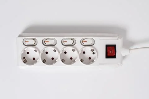 White Electrical plug in outlet socket at home isolated on white background Stock Photos