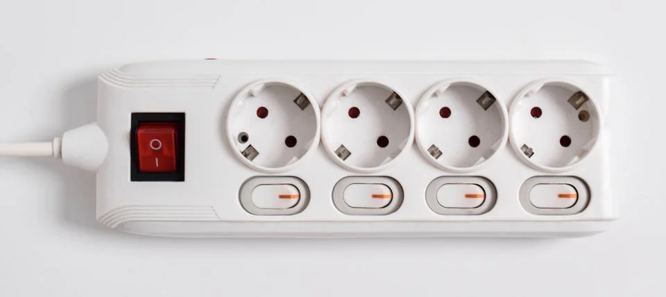 White Electrical plug in outlet socket at home isolated on white background Stock Photos