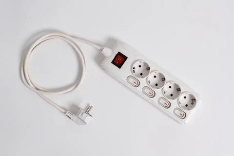 White Electrical plug in outlet socket at home isolated on white background Stock Photos