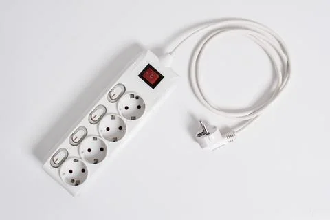 White Electrical plug in outlet socket at home isolated on white background Stock Photos