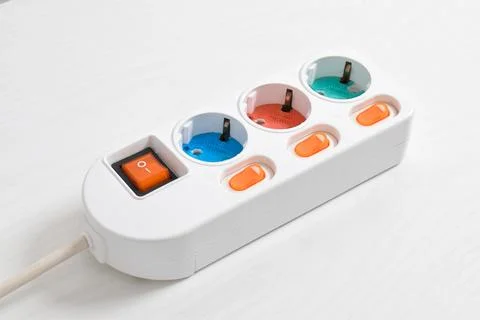 White Electrical plug in outlet socket at home isolated on white background Stock Photos