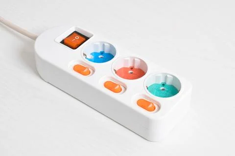 White Electrical plug in outlet socket at home isolated on white background Stock Photos