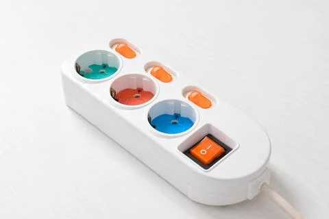 White Electrical plug in outlet socket at home isolated on white background Stock Photos