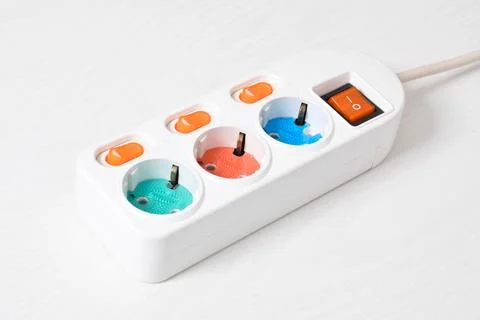 White Electrical plug in outlet socket at home isolated on white background Stock Photos