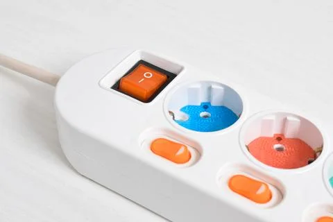 White Electrical plug in outlet socket at home isolated on white background Stock Photos