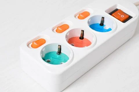 White Electrical plug in outlet socket at home isolated on white background Stock Photos