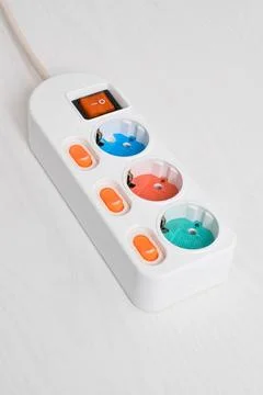 White Electrical plug in outlet socket at home isolated on white background Stock Photos