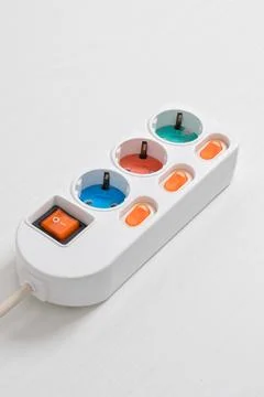 White Electrical plug in outlet socket at home isolated on white background Stock Photos