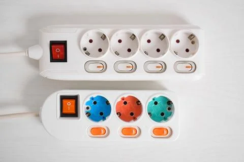 White Electrical plug in outlet socket at home isolated on white background,  Stock Photos