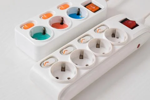 White Electrical plug in outlet socket at home isolated on white background,  Stock Photos