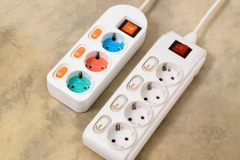 White Electrical plug in outlet socket at home Stock Photos
