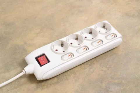 White Electrical plug in outlet socket at home Stock Photos