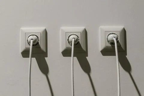 White electrical sockets with plugs in them. connecting high-voltage wire t.. Stock Photos