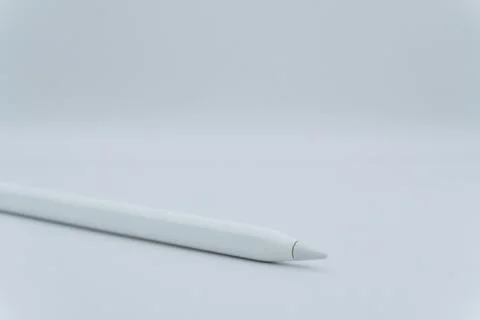A white electronic pen on a white background, an electronic pencil for a tablet Stock Photos