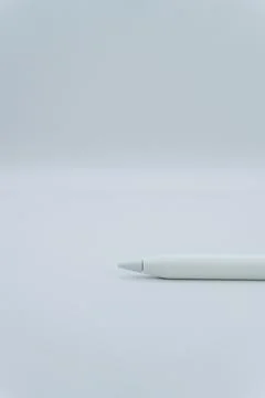 A white electronic pen on a white background, an electronic pencil for a tablet Stock Photos