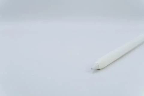 A white electronic pen on a white background, an electronic pencil for a tablet Stock Photos