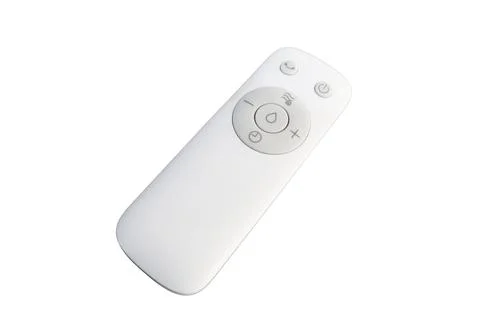 White electronic remote control with function buttons isolated on a white Stock Photos