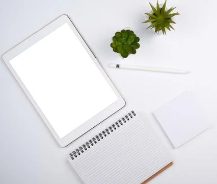 White electronic tablet with a blank screen and a pencil Stock Photos