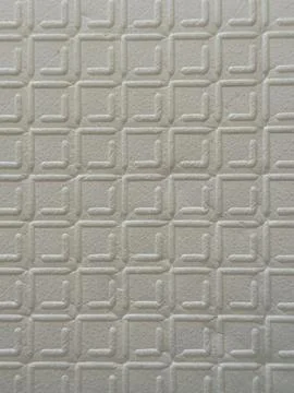 White Embossed Geometric Pattern Wallpaper Texture Close-Up Stockfoto's