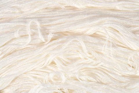 White embroidery floss as background texture close up Stock Photos