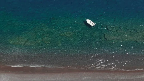 White empty boat drifts on transparent sea water surface Stock Footage 114367683