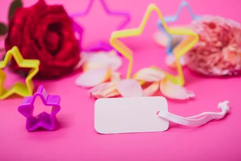 White empty card and stars on pink background. Greeting card festive holiday  Stock Photos