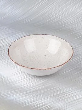 White empty deep clay plate with a spoon on a gray background. Stock Photos