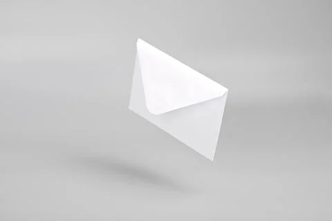 White empty envelope levitating on gray background with shadow Foto stock