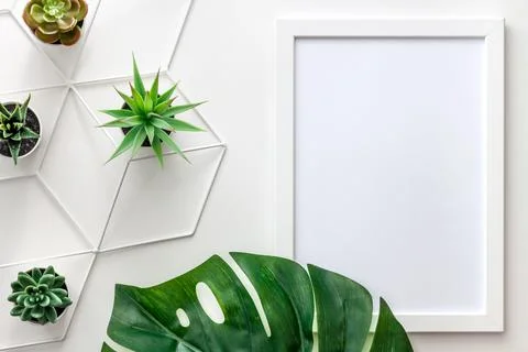 White empty frame with space for your graphic. Mockup. Decoration with a leaf Stock Photos