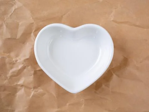White empty heart shaped ceramic bowl Stock Photos