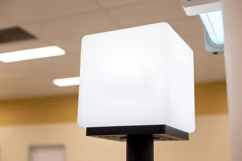 White empty light information cube on the counter, with a place for text, in a Stock Photos