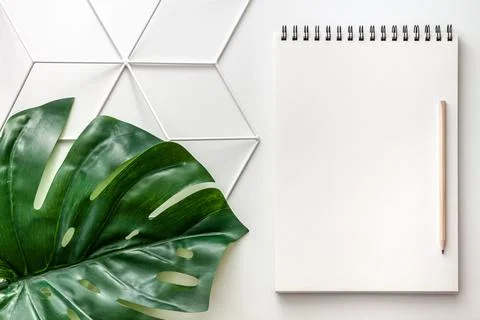 White empty notebook with space for your text on a geometric pattern. Stock Photos