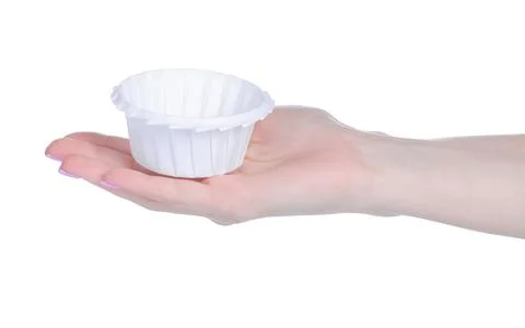 White empty paper molds for cupcakes in hand Stock Photos