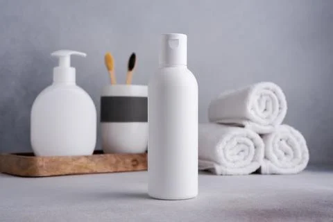 White empty shampoo or lotion bottle for mock-up in Scandinavian bathroom int Stock Photos