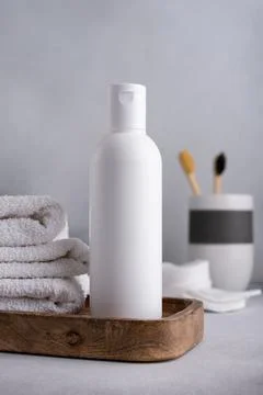 White empty shampoo or lotion bottle for mock-up in Scandinavian bathroom int Stock Photos