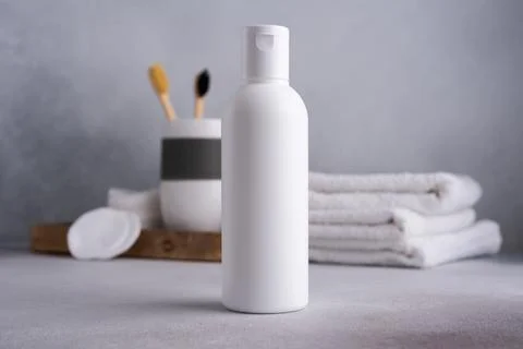 White empty shampoo or lotion bottle for mock-up in Scandinavian bathroom int Stock Photos
