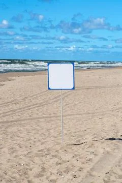 White empty signboard on the Baltic beach Stock Photos
