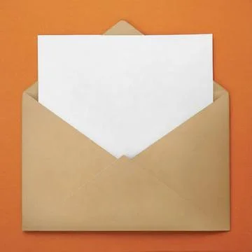 White Envelope with Blank Orange Sheet of Paper Inside Stock Photos
