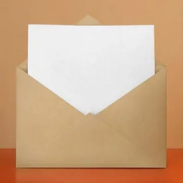 White Envelope with Blank Orange Sheet of Paper Inside Stock Photos