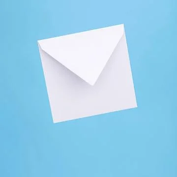 White envelope on blue background with flap open Stock Photos
