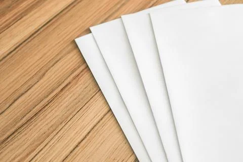 White envelope on board table Stock Photos
