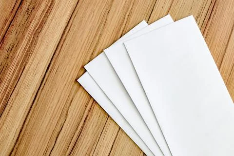 White envelope on board table Stock Photos