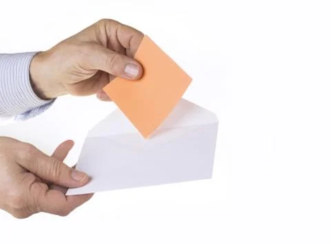 White envelope with paper note with man hand on the white background Stock Photos