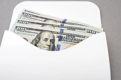 White envelope with the US Dollars Stock Photos