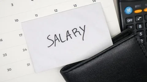 A white envelope with the word "SALARY" written on it is attached to the ca.. Stock Photos