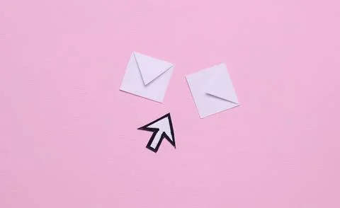 White envelopes and a black cursor arrow on pink background Stock Photos