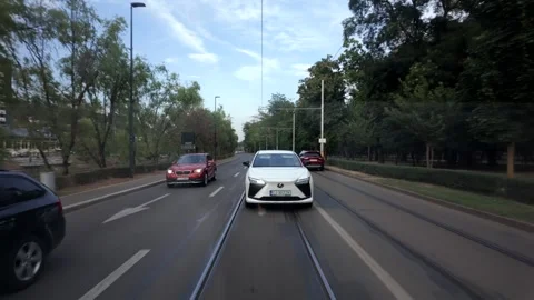 White EV Following Tram Video stock 345091635