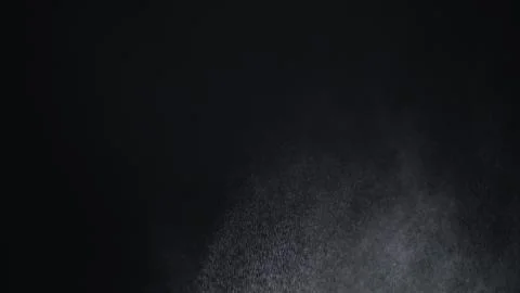 White exploding powder over black background Illustrazione stock