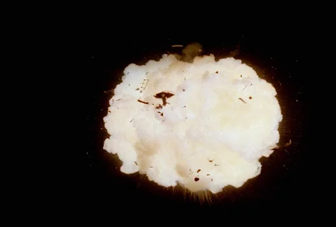 White explosion with debris Stock Footage 86915169