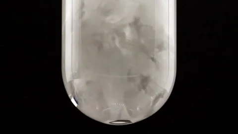 White Explosion of Particles Powder Background in Glass Test tube. White Smoke Video stock 266940049